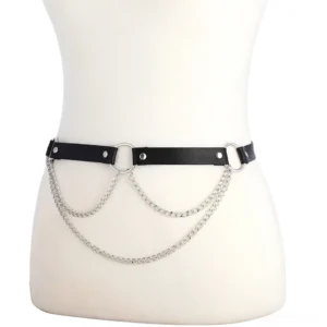 Adjustable gothic body harness flat lay on white mannequin - showing single leather strap with triple silver chain layers and central O-ring