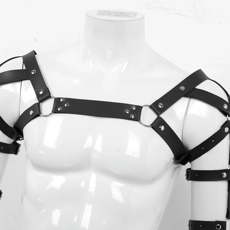 Faux leather chest harness flat lay, featuring metal hardware and adjustable strap system