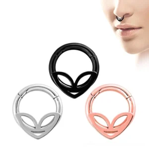 Alien clicker nose hoop ring worn on face showing double-layer design and hinged mechanism in multiple color finishes
