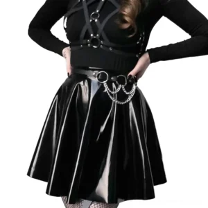 Gothic waist harness with silver chain accents displayed on model in punk outfit, waist-level front view highlighting chain arrangements and leather construction