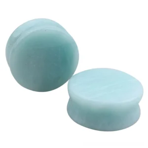 Light blue amazonite stone ear gauges with natural veining, double flared round plugs shown in flat lay overhead view against white background