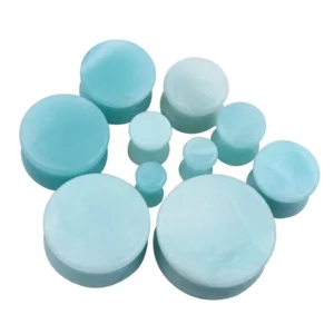 Genuine amazonite stone ear tunnels close-up detail showing natural cyan coloring and polished surface finish for gothic ear stretching jewelry