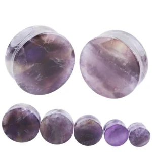 Natural amethyst ear plugs detail view highlighting polished stone texture, authentic purple coloring with veining patterns, and professional finish for gothic body jewelry collection