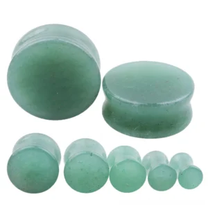 Close-up detail of aventurine stone ear plug gauge showing matte texture and natural green coloring for gothic earrings