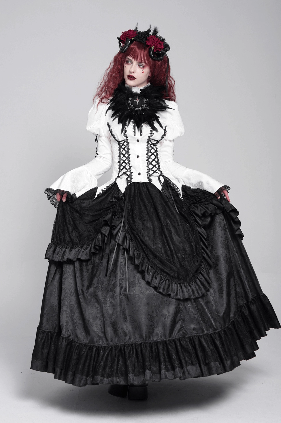 Ivory gothic lace corset blouse back corset ties detail showing back lace-up design, ribbon construction, and structured gothic detail