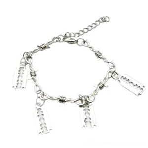 Barbed wire gothic bracelet flat lay top-down view showing four blade charms and adjustable extension chain in silver zinc alloy
