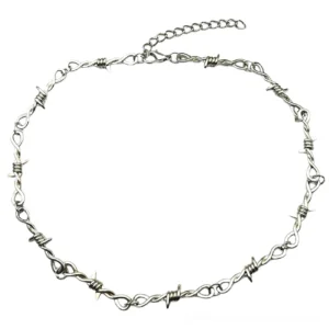 Adjustable barbed wire metal necklace flat lay top-down view showing full length with extension chain