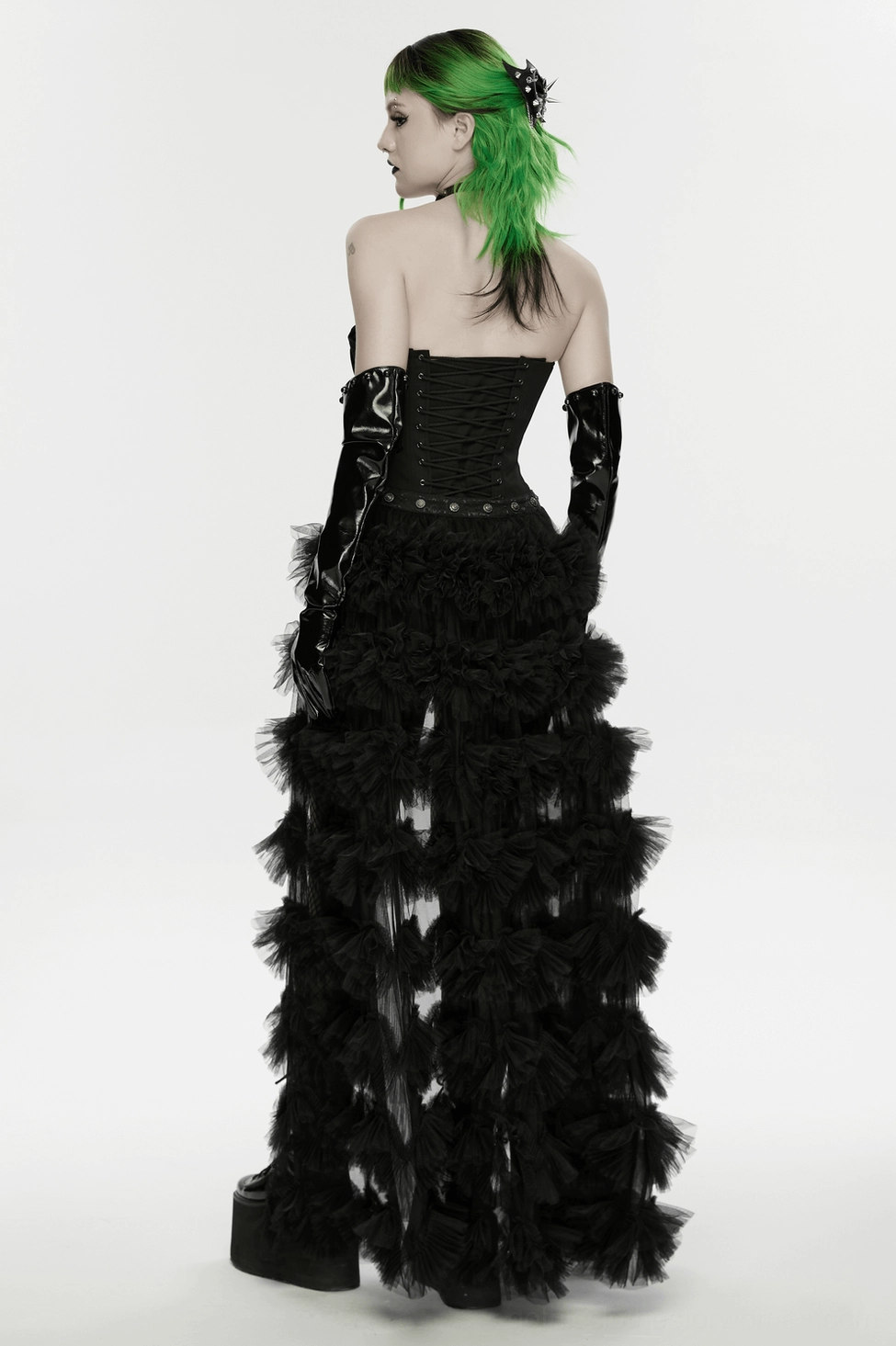 Premium close-up photography of punk gothic bat wing hair clip with spike and chain elements