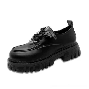 Black matte PU leather bat wing platform loafers with metal chain details, left three-quarter view showcasing gothic embellishments