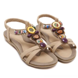 Beige PU leather beaded sandals with colorful gemstone decorations and elastic ankle strap, oblique angle on white background