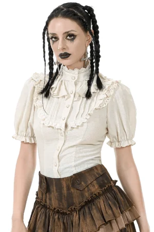 Gothic beige puff sleeve blouse with high stand collar and lace ruffle front worn by model with braided pigtails, studio front view