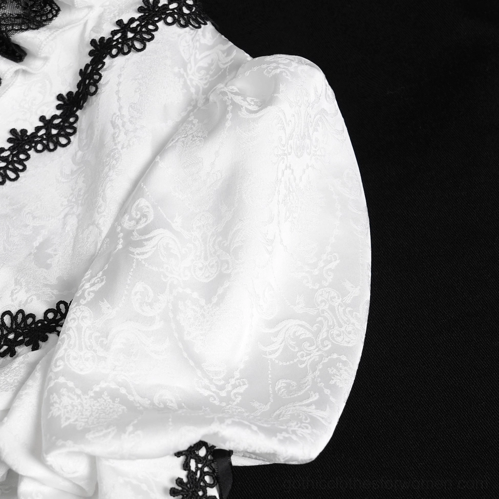 White gothic lace blouse bell sleeve cuff detail showing lace-trimmed edges, bell flare construction, and delicate lace accents