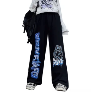 Black wide leg gothic anime print jogger pants front view on model, oversized fit with graffiti text and character graphics