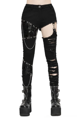 Black asymmetrical gothic pants with chain and mesh cutouts, front full-body view on model, featuring ripped details and metal hardware