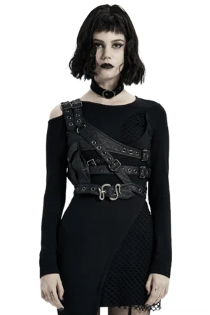 Black asymmetrical leather shoulder harness with python buckle worn by model, front half-body view with metal eyelets and crinkled leather texture