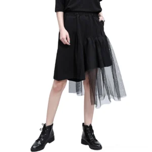 Black asymmetrical mesh gothic shorts with irregular hemline and high elastic waist, front full-body view on female model