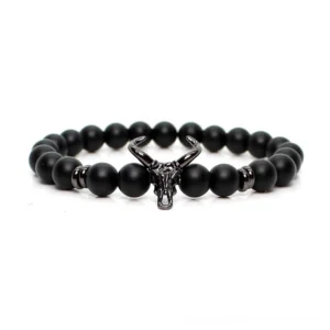 Black matte stone beads with silver bull head charm gothic bracelet flat lay top view