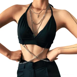 Black halter crop top with detachable waist chain on model, hands on hips, studio shot