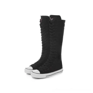 Black knee-high canvas sneaker boots with white rubber trim and lace-up closure