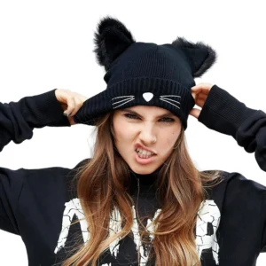 Black cat ear beanie with embroidered whiskers worn by model - front view alternative fashion