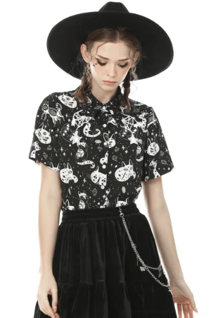 Black cat gothic blouse with pentagram print, front full-body view on model with black wide-brimmed hat, alternative fashion style