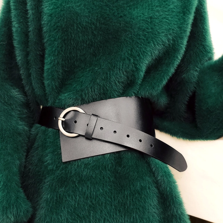 Black PU leather corset belt worn with green fuzzy coat side view waist-level detail shot