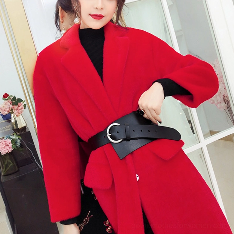 Black leather corset belt styled with red wool coat half-body fashion shot indoor setting