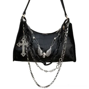 Black crocodile embossed gothic shoulder bag with detachable layered metal chains, winged skull and cross charms, front flat view