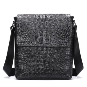 Black gothic crocodile embossed leather crossbody bag front view with embossed logo on flap