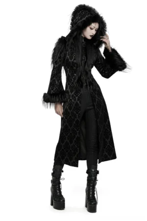 Black damask jacquard hooded gothic coat with faux fur trim and gemstone buttons, front three-quarter view on model
