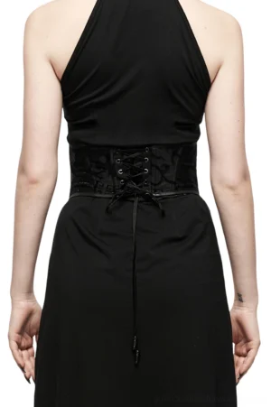 Black dragon corset belt back view showing lace-up closure with decorative drawstring, paired with black halter dress