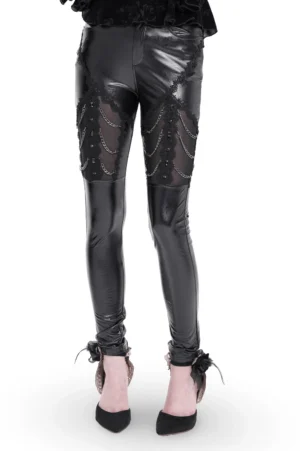 Black faux leather gothic pants with chain and sequin thigh embellishments, front studio view worn by female model