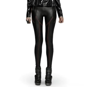 Black faux leather gothic pants with red contrast stitching front view on model wearing punk boots and cropped jacket