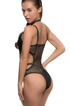 Black gothic monokini back view showing open back design and cheeky cut with strappy details
