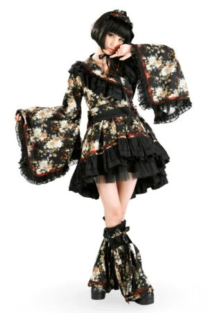 Black floral gothic lolita dress front three-quarter view with wide bell sleeves and tiered ruffled skirt on model