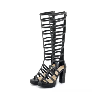 Single black knee-high gladiator heel sandal front three-quarter perspective showcasing PU leather cutout strappy design