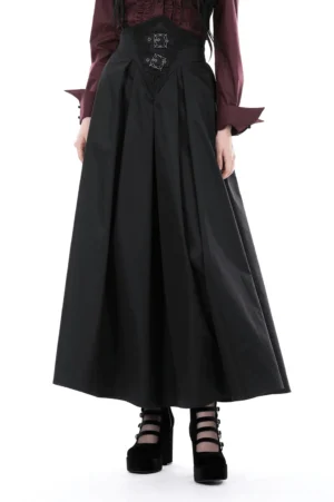 Black A-line gothic skirt front view with ornate lace corset waist belt and silver buckles on model wearing white blouse
