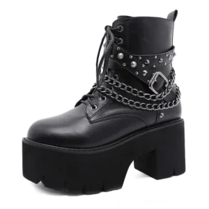 Single black gothic ankle boot showing three-quarter front view with metal chain straps and stud accents on white studio backdrop