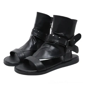 Black goth ankle strap gladiator sandals with riveted buckle, front three-quarter view showing open toe and metal hardware details