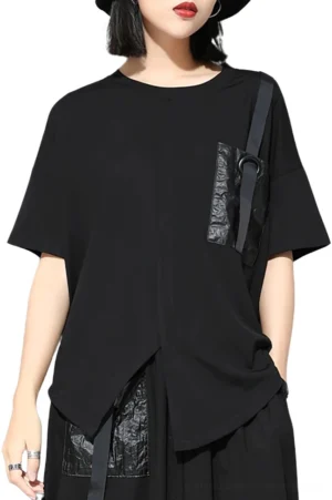 Black gothic asymmetric T-shirt front view on model, featuring patch pocket with decorative strap and metal ring, drop shoulder sleeves, and irregular split hem