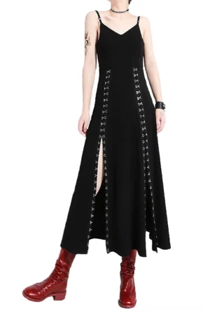 Black asymmetrical spaghetti strap gothic maxi dress with side slit, displayed on model from front view with red ankle boots