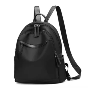 Black gothic minimalist backpack front view, solid oxford cloth with leather accents and dual metal zippers