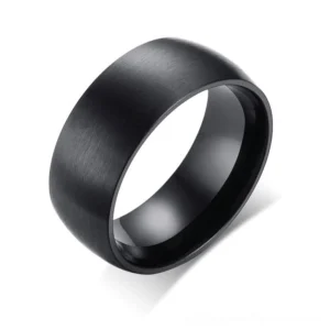 Black matte stainless steel gothic band ring 8mm wide, three-quarter oblique view showing brushed finish and geometric design