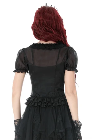 Black gothic blouse back view showing sheer fabric and ruffled hem detail on model