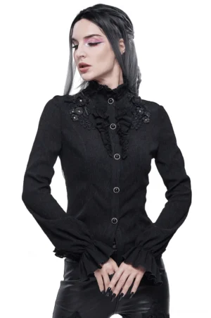 Women's black gothic stand collar blouse with floral appliqué and decorative gem buttons, front three-quarter view on model