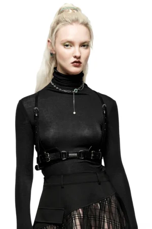 Black gothic body harness front view on model, adjustable shoulder straps and metal nameplate, punk leather chest harness styling