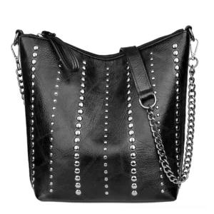 Black gothic studded bucket shoulder bag with vertical metal rivets and chain strap on white background, front view