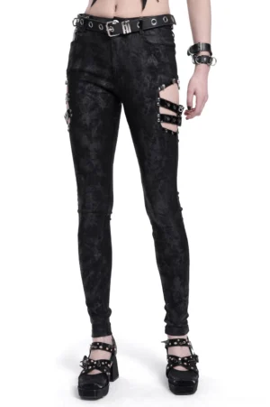 Black gothic buckle pants front view on female model wearing platform heels, showing side buckle cutouts and slim fit silhouette