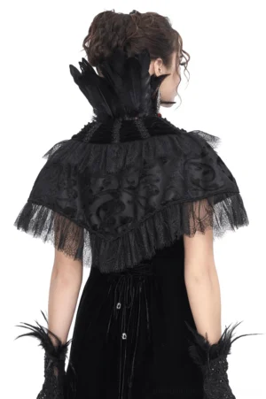 Black gothic feather cape back view showing damask embossed velvet, lace fringe hem, and feather neck accent