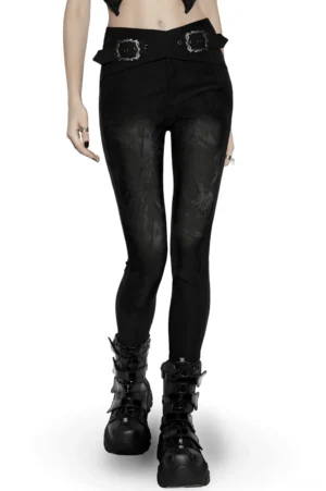Black gothic castle jacquard skinny denim pants with dual buckle waist, front three-quarter view worn by model
